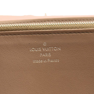 LOUIS VUITTON Taurillon Capucines Wallet Magnolia