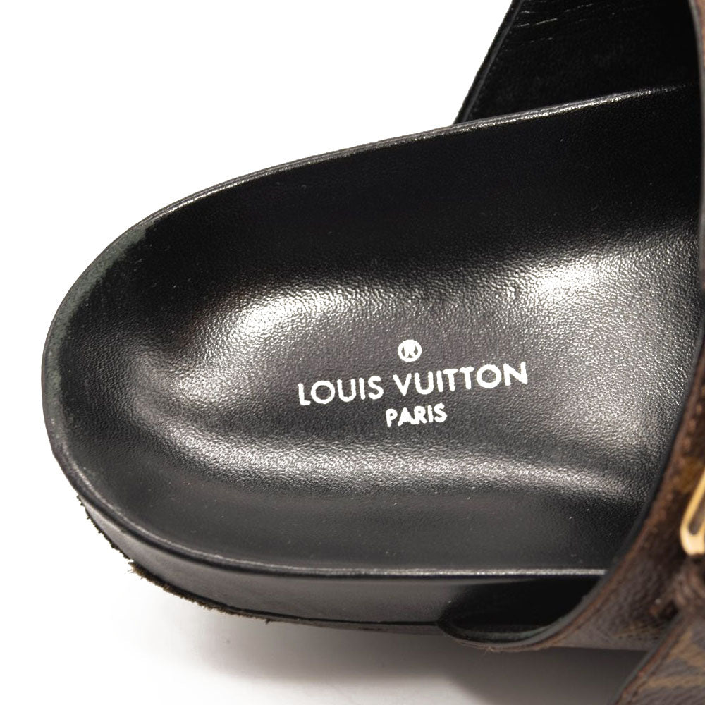 Louis Vuitton Lock It Leather Mules In Black