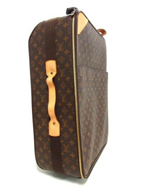A Louis Vuitton Monogram Pegase Suitcase. Durable Leather Exterior